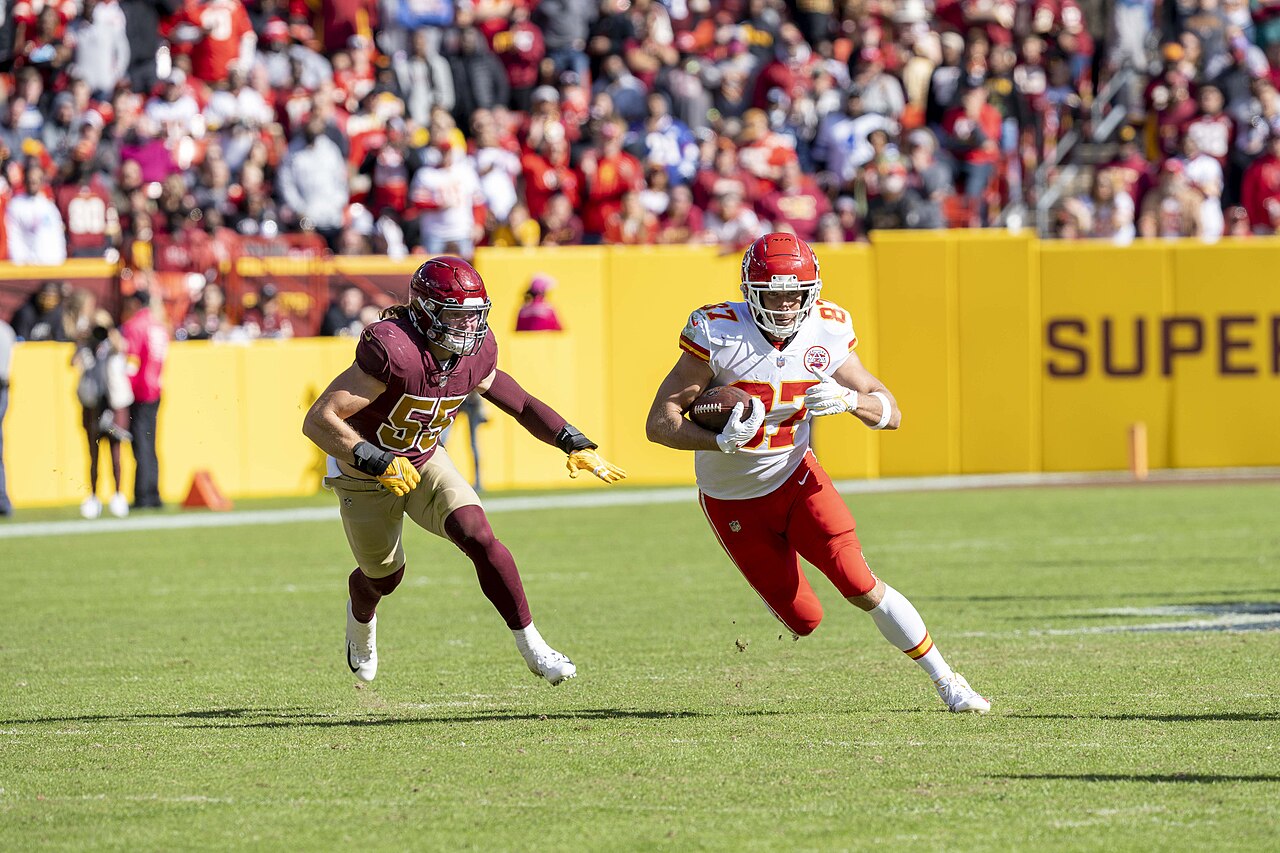 Kansas City Chiefs tight end Travis Kelce runs with the football against Washington in 2021